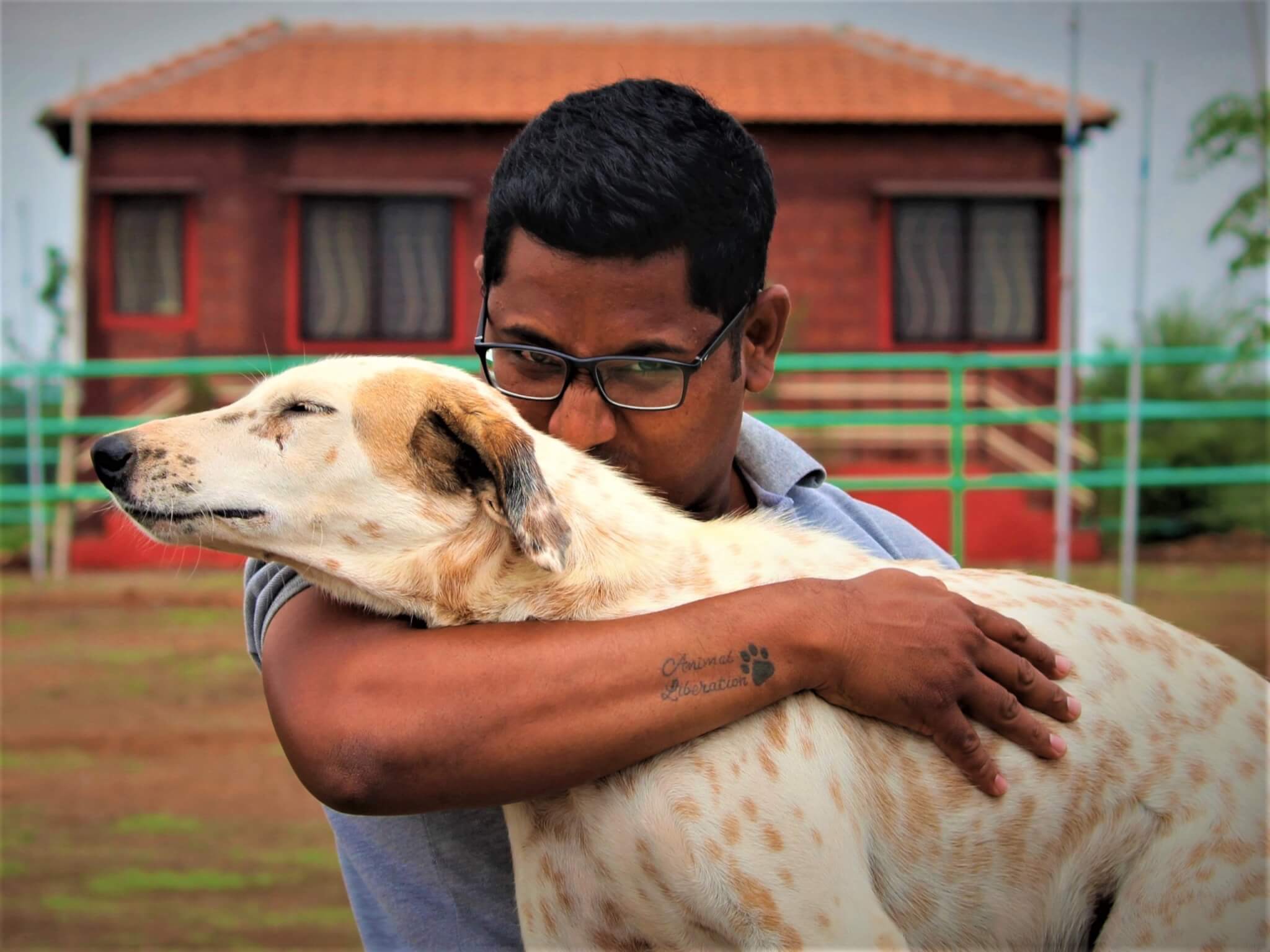 Tommy savors a hug from a staff member.